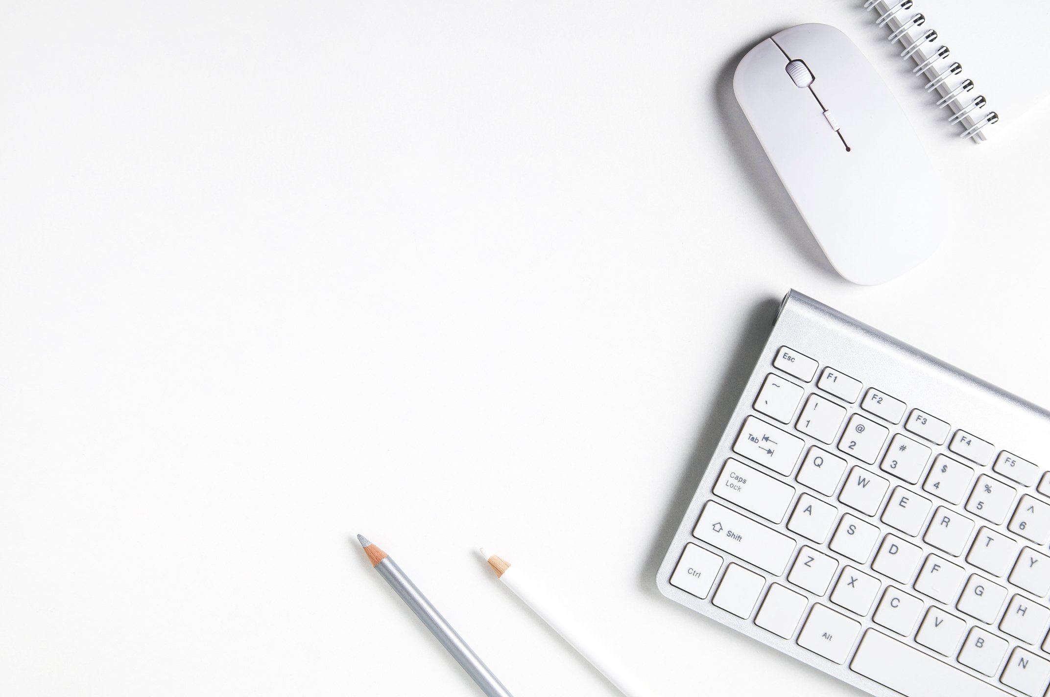 White computer mouse and keyboard on white background